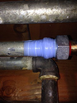 compression seal tape wrapped around a pipe